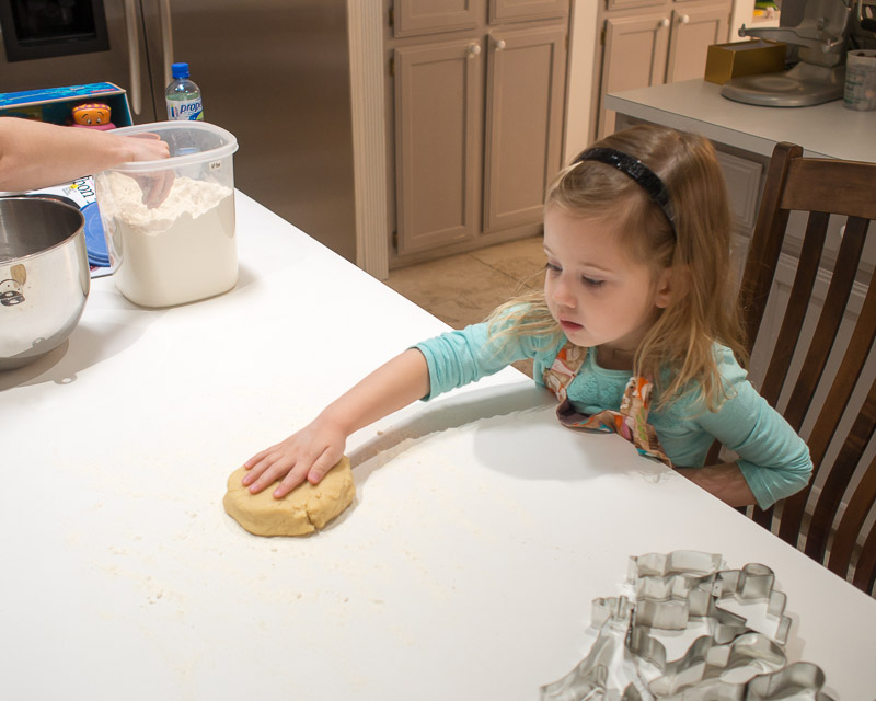 Examining the dough.