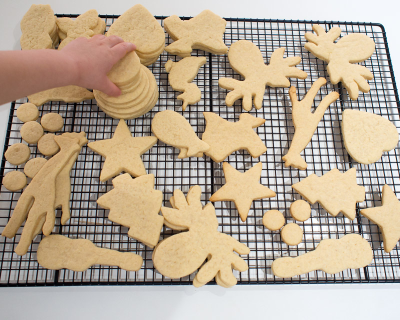 Piling up the un-iced cookies.