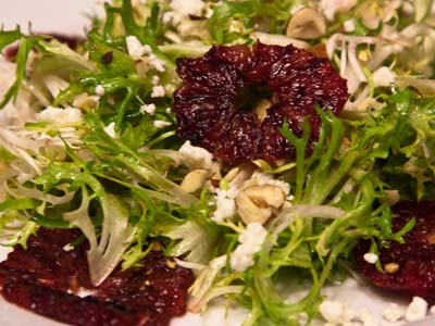 Frisee salad with blood orange, feta, and hazelnuts