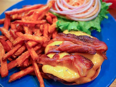 bacon cheese burger and sweet potato fries